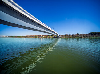 View of cartuja footbridge over guadalquivir river in seville