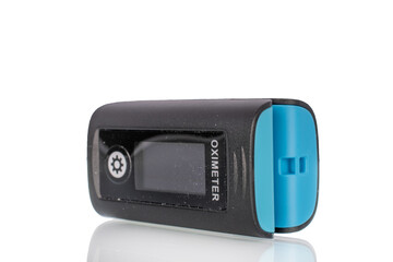 Pulse oximeter is a medical diagnostic device for measuring the level of oxygen saturation in capillary blood (oxygenation) isolated on a white background, macro.