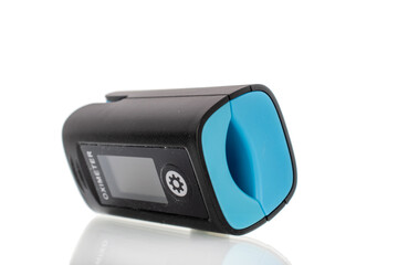 Pulse oximeter is a medical diagnostic device for measuring the level of oxygen saturation in capillary blood (oxygenation) isolated on a white background, macro.