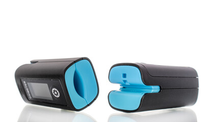 Pulse oximeter is a medical diagnostic device for measuring the level of oxygen saturation in capillary blood (oxygenation) isolated on a white background, macro.