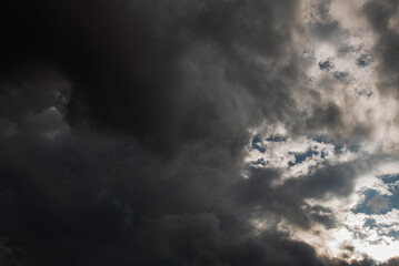Dramatic dark storm thundercloud rain clouds on black sky background. Dark thunderstorm clouds rainny landscape. Meteorology danger windstorm disaster climate. Dark cloudscape storm disaster gray sky