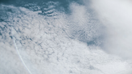 Obraz premium Cloudscape An Aerial Perspective of Fluffy Clouds and Blue Sky, Capturing Natural Beauty