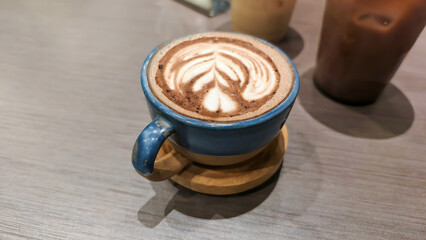 Aromatic cup of coffee with artistic latte art, a warm delight