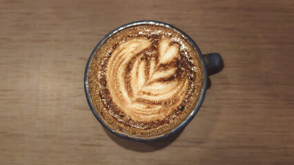 Aromatic Coffee A Morning Wake-Up with Floral Latte Art on Wooden Table
