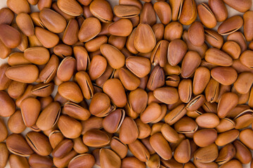 Pine nuts background. Close up of pine nuts background. Top view.