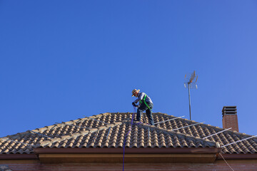 Senior Installer preparing a roof for solar panel installation