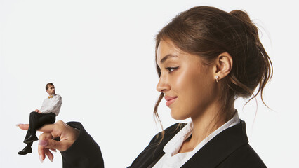 Collage of smiling businesswoman holding tiny man on her finger with confident look. Concept of...