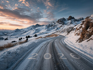 The number 2026 painted on a curving, snowy mountain road leading into a rugged, winter landscape at sunset, symbolizing a challenging future journey.