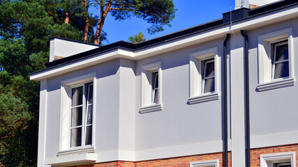 Newly built terraced houses in a residential area. Modern terraced houses on the outskirts of the city.