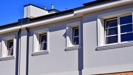 Newly built terraced houses in a residential area. Modern terraced houses on the outskirts of the city.