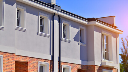 Newly built terraced houses in a residential area. Modern terraced houses on the outskirts of the city.