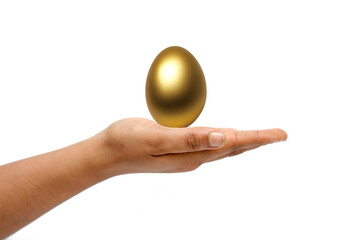 Golden egg in hand on white background.