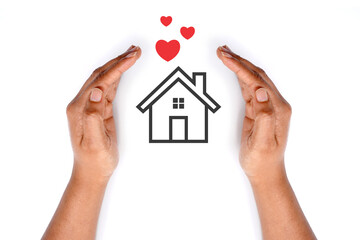House with hearts covered by hands. meaningful image. white background