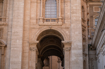 Historic stone arch and ornate architectural details of ancient European building facade
