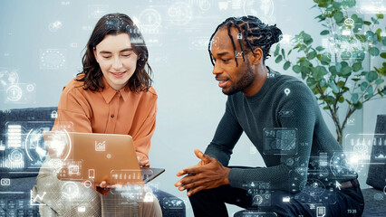 Multinational group having a conversation in an office with digital technology