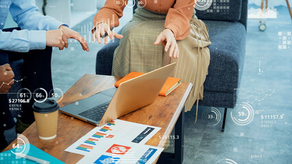 Multinational group of people talking in an office with statistical data