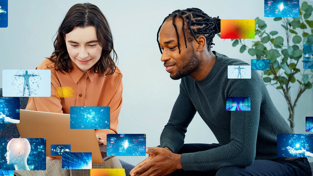 Multinational group having a conversation in an office and digital content - Powered by Adobe