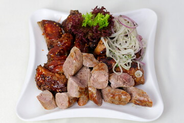 Meat onions lettuce Doner kebab is on the cutting board. Shawarma with meat, onions, lettuce lies on a black background.