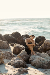 Young woman enjoying a peaceful moment by the ocean in Miami Beach