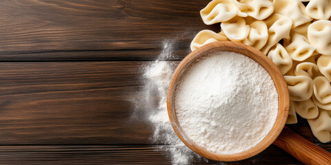 Handmade cappelletti displayed in a round wooden bowl on a beautifully decorated table, surrounded by pine branches, a rolling pin, and a sprinkle of flour, creating a festive culinary setting