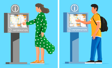 Woman and man using interactive information kiosk with city map. Digital public display for navigation and guidance in urban area.