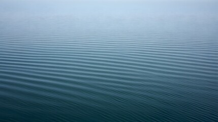 Calm, rippling water surface creates a tranquil, abstract texture.