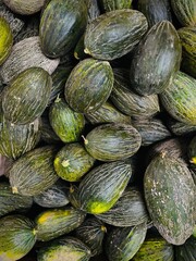 melons at the market. Fruit Background. A Lot Of Big Sweet Green Organic Ripe Watermelons In The Farmers Market ( Supermarket ) In Viet Nam, Asia. Nutrition And Vitamins. Healthy Raw Diet Food.