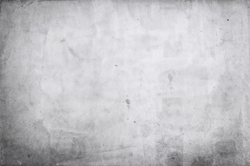 Fototapeta premium Vintage monochrome newspaper backdrop with grainy paper texture and faded white area for text or writing