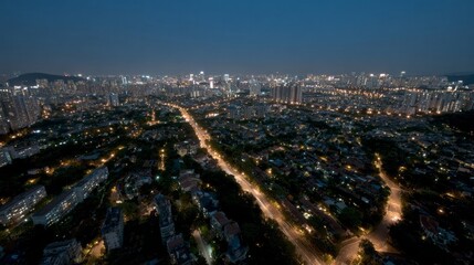 Cityscape at dusk, lights flicker like constellations beneath indigo skies, evoking Diwali illumination and International Dark Sky Week