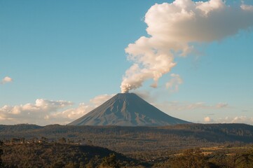 Fototapeta premium Volcanic fumarole eruption under a bright sky as seen from a nearby town