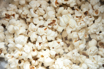pile of popcorn in a stainless steel pot.