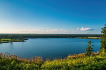 Wide scenic backdrop featuring water, sky, and lush greenery during summer travel