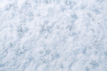 Obraz premium Close-up view of pristine snow surface showing natural texture and patterns.
