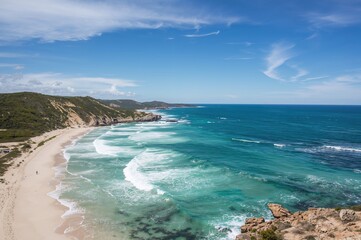 During the summer, I visited a gorgeous seaside destination, delighting in the crystal-clear ocean, magnificent scenery, and the cool water blending with the horizon.