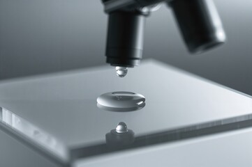 Microscope backdrop featuring liquid cool gray gel or serum mirror glass