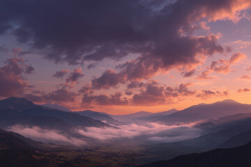 Fototapeta premium Dreamy clouds floating over a quiet mountain valley during sunset radiating soothing orange and purple hues.