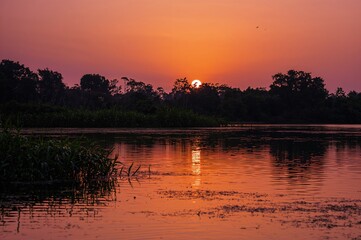 A tranquil water body mirroring the evening sky.