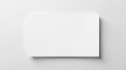 Fototapeta premium Blank Rectangular Paper Mockup on a Smooth Surface for Design Presentations and Branding