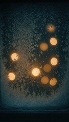 Frosty window with glowing lights mobile wallpaper