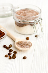 Homemade body peeling cocoa-sugar on wooden background close up