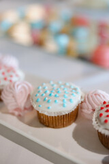 Delightful cupcakes and sweet treats at a festive dessert display