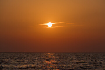 Sunset Over the Sea in Warm Orange Light