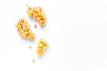 Many fresh green grape clusters isolated on white background.