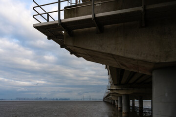 long bridge on mudflat beach