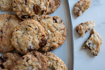 A plate of fresh baked oatmeal and chocolate chip cookies