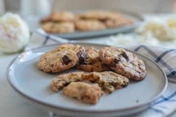 A plate of fresh baked oatmeal and chocolate chip cookies