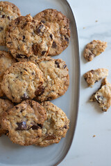 A plate of fresh baked oatmeal and chocolate chip cookies