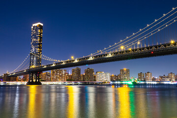 View of the Manhattan Bridge and Manhattan at night.