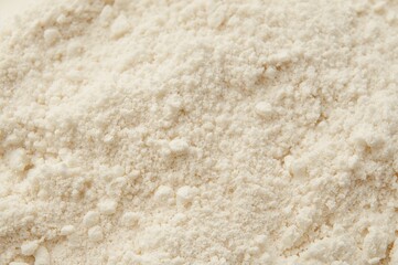 Fototapeta premium Close-up macro texture of white fine flour powder for food advertising