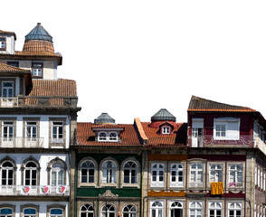 Historic buildings in Guimaraes, Portugal, with colorful facades, arched windows, and terracotta